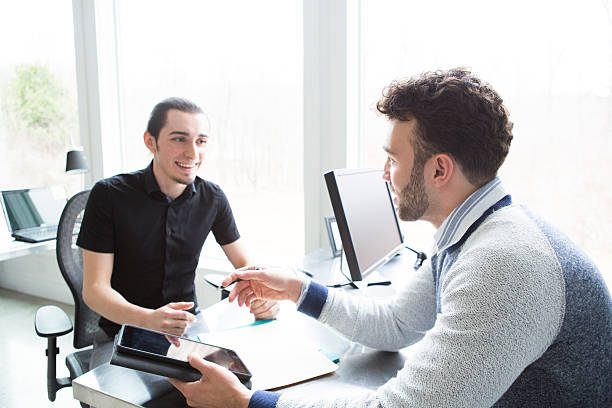istock Young Businessmen in an Office Talking 518461144