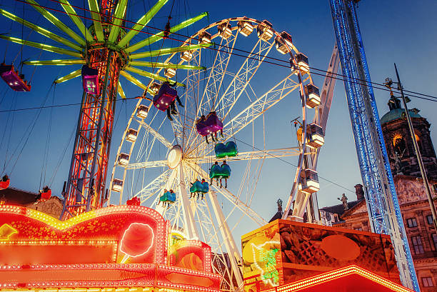 amusement park carousel - kermis stockfoto's en -beelden