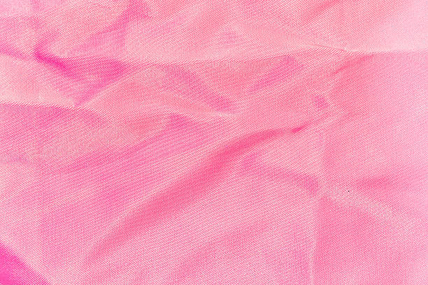 istock background, texture of crumpled pink silk fabric 518461270