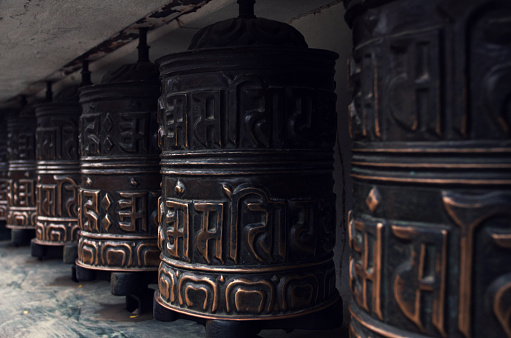 Close-up of rolls of prayer in Buddhist temples in Nepal