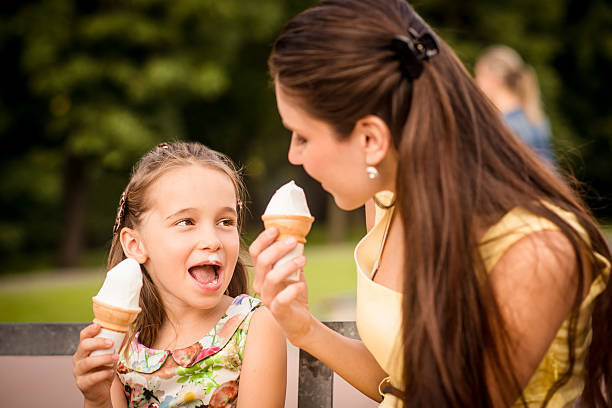 istock Mother and child enjoying icecream 518463126