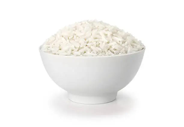 Photo of cooked rice in white cup or bowl with clipping path