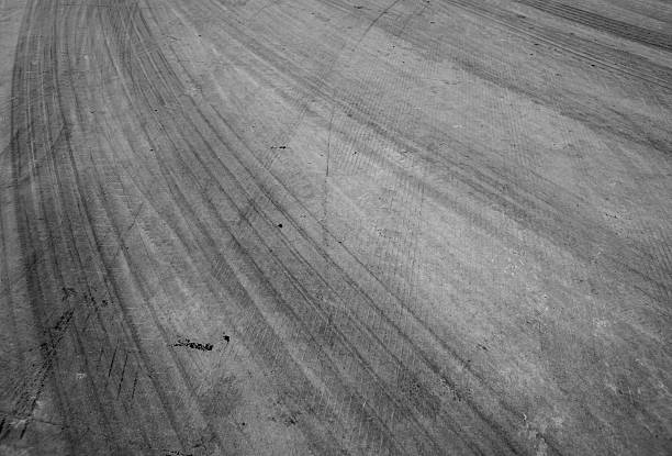istock Abstract road background with tracks of tires. 518464964