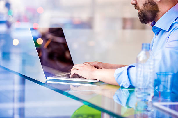 istock Hipster manager in cafe, working on laptop by window 518466280