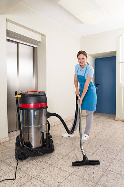 istock Female Janitor Cleaning Floor 518467030
