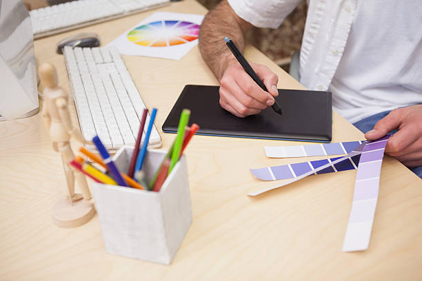 istock Artist drawing something on graphic tablet 518467073