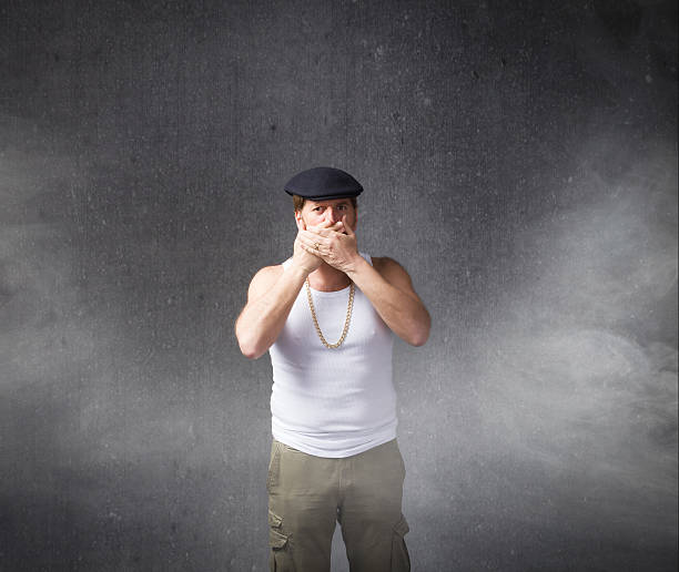 istock sicilian man with coppola on head silence concept 518467287