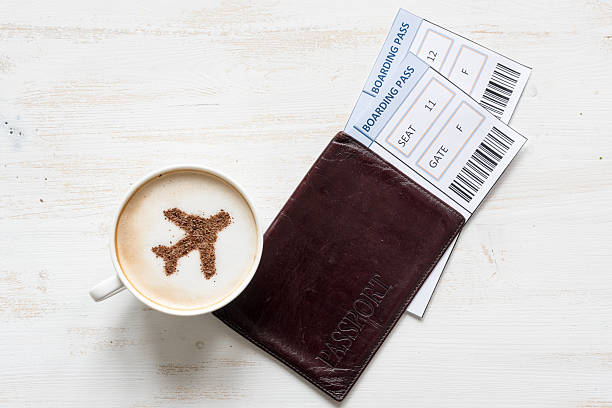 istock Airplane made of cinnamon in cappuccino and boarding passes. 518467718