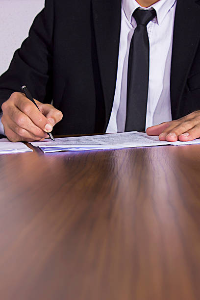 istock Businessman Signing Contract Paper 518467866