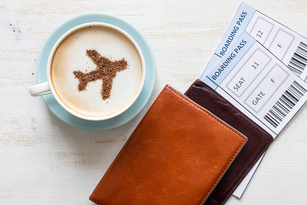istock Airplane made of cinnamon in cappuccino and boarding passes. 518467966