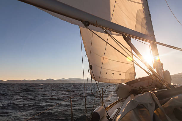 istock Sailboat at sunset ocean 518468124