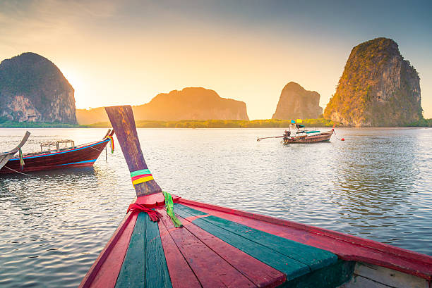 istock Beach and tropical sea with long-tail boat in thailand 518468630