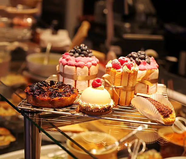 Photo of French pastries on display a confectionery shop
