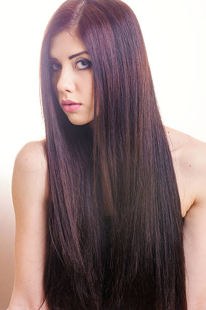 istock Young woman with long hair 518469608