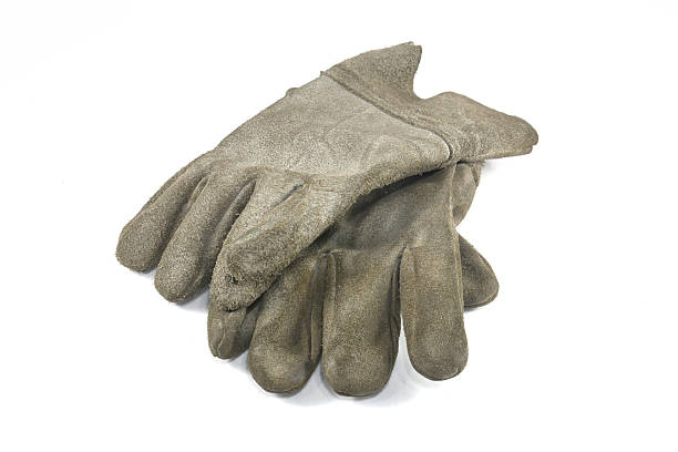 istock Old Dirty Work Gloves Isolated On White 518470455