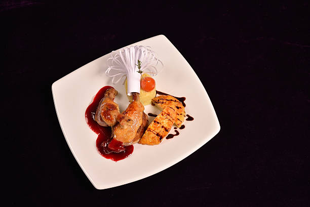 istock Glazed duck leg, risotto with truffle oil, fig and sauce 518470710