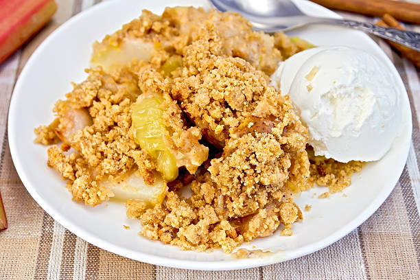 istock Crumble with rhubarb in dish on linen tablecloth 518471021