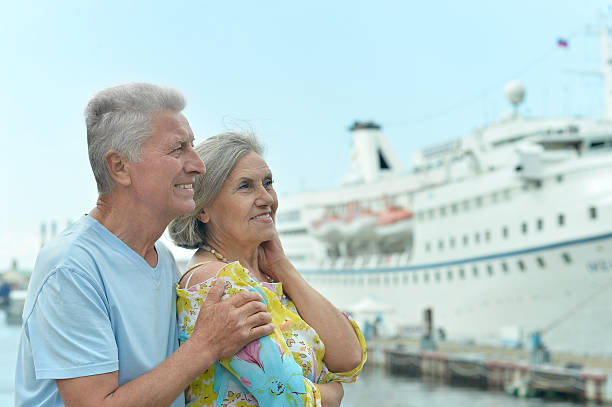 istock Senior couple standing on pier 518472474