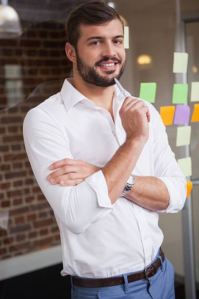 istock Casual businessman smiling at camera 518472673