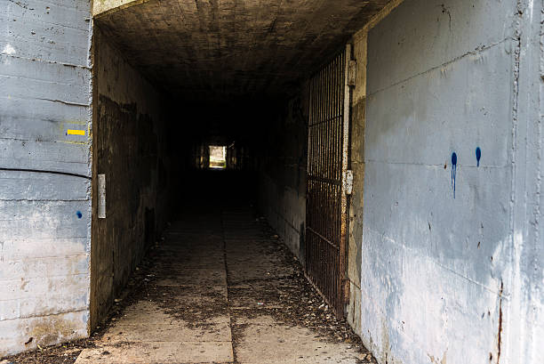istock Cement tunnel with open door 518472732