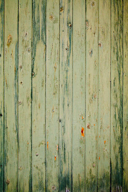 istock Green Peeling Wooden Planks Background Texture 518473233