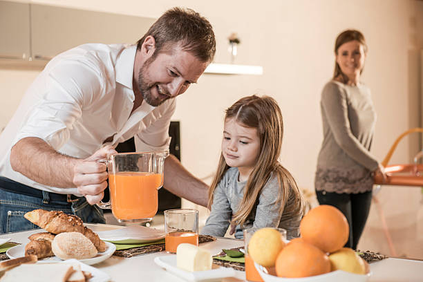 istock Father Having Breakfast With His Little Girl 518474283