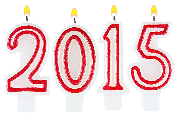istock candles new year 2015 isolated on white background 518479991