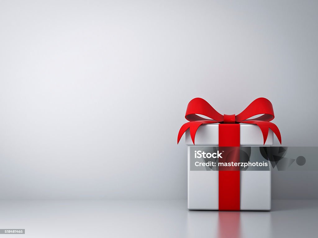 Gift box with red ribbon bow with empty white wall Gift box with red ribbon bow and empty white wall background abstract. Gift Box Stock Photo