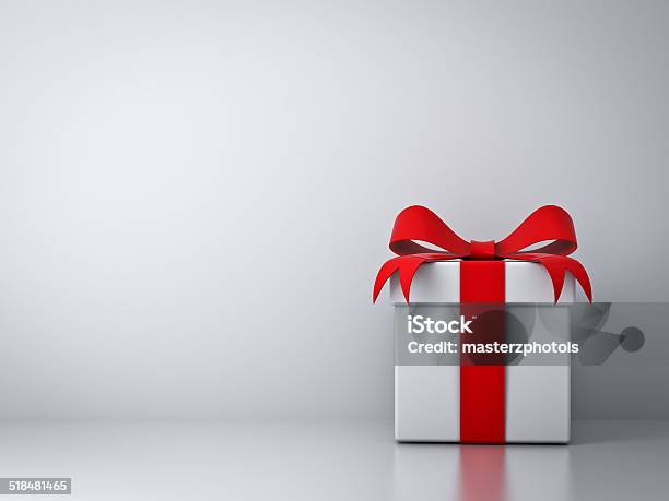 Gift Box With Red Ribbon Bow With Empty White Wall Stock Photo - Download Image Now - Gift Box, Gift, Christmas Present