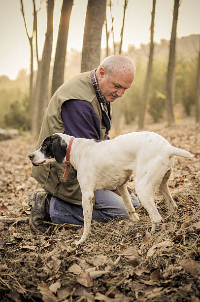istock Man and his dog searching truffle 518482445
