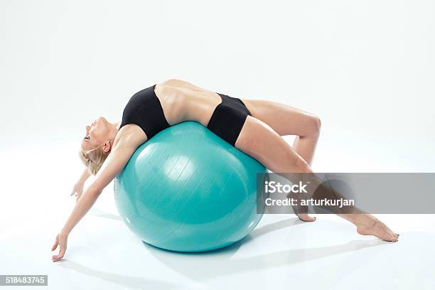 One Caucasian Woman Exercising Fitness Ball Workout Stock Photo - Download Image Now