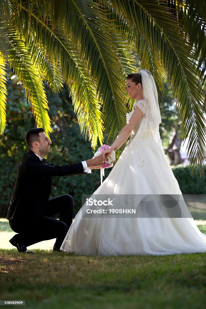bride and groom in garden Adult Stock Photo