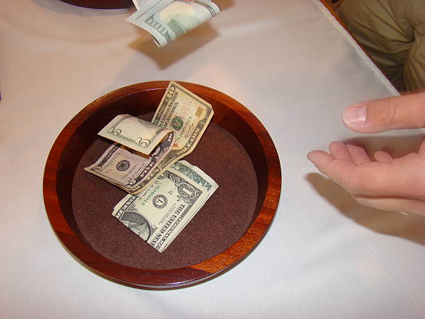 istock Man holding Religious Offering Collection Plate 518484113