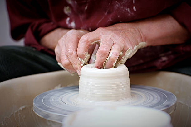 istock Potter at work moulding a clay pot 518484461