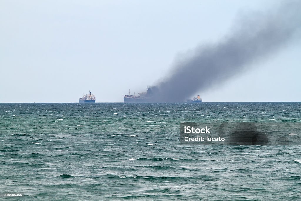Accident at sea accident at sea - Cargo ship on fire. Fire - Natural Phenomenon Stock Photo