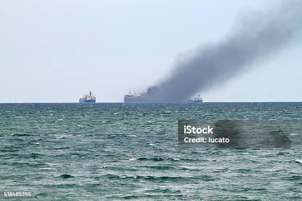 Accident At Sea Stock Photo - Download Image Now - Fire - Natural Phenomenon, Container Ship, Ship