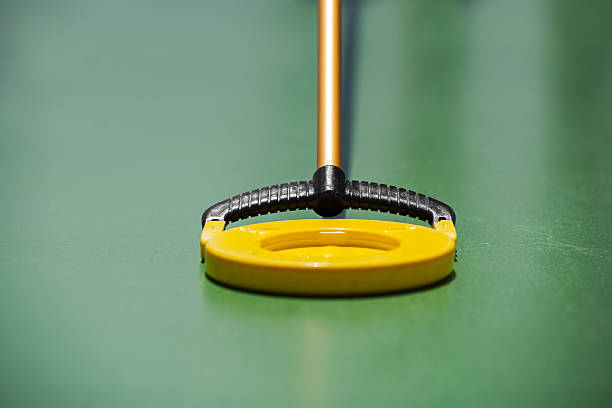 Shuffleboard Shuffleboard disc close-up. pool cue stock pictures, royalty-free photos & images