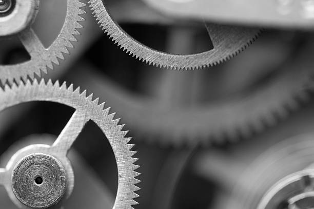 istock Black and white background with metal cogwheels a clockwork. 518486807