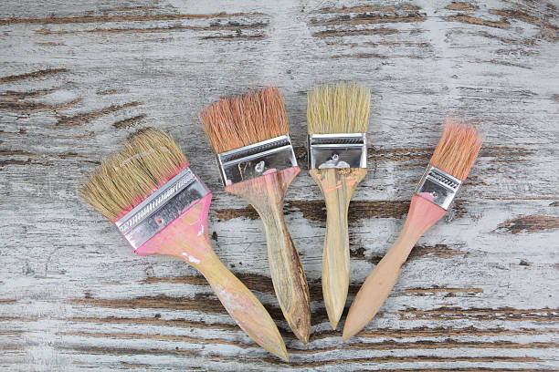 istock Set of paintbrushes in a wood background 518487387