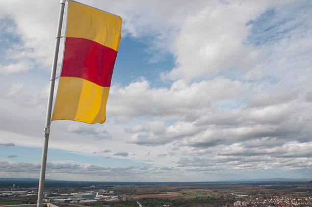 Flag of Baden-Wuerttemberg over the city of Karlsruhe Flag of Baden-Wuerttemberg over the city of Karlsruhe karlsruhe durlach stock pictures, royalty-free photos & images