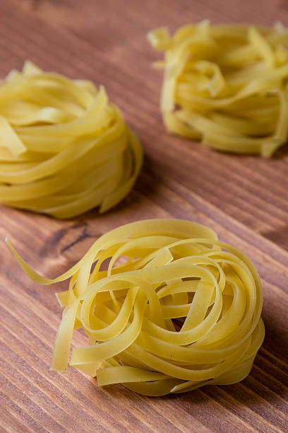tagliatelle pasta on brown table