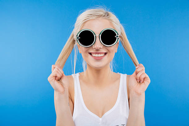 istock Woman in sunglasses looking at camera 518494782