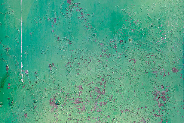 istock Old green cracked paint on metal background 518494884