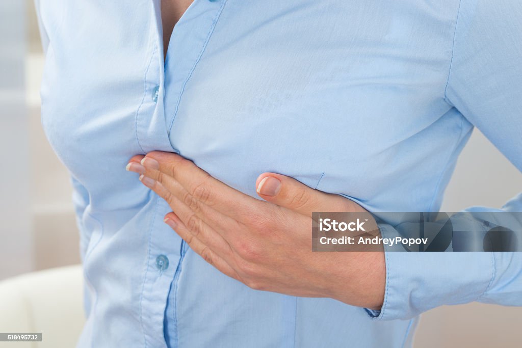 Businesswoman Suffering From Pain Close-up Photo Of Businesswoman Suffering From Pain Breast Stock Photo