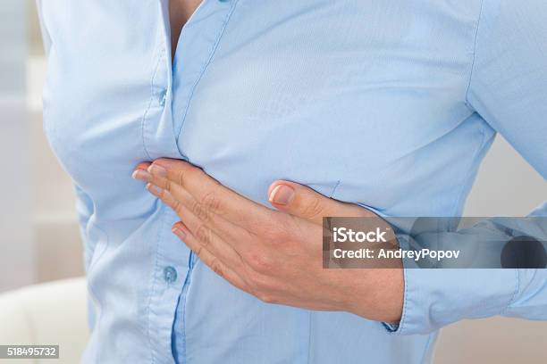 Businesswoman Suffering From Pain Stock Photo - Download Image Now - Breast, Pain, Chest - Torso