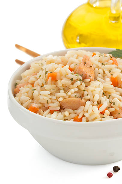 istock bowl full of rice on white 518497885