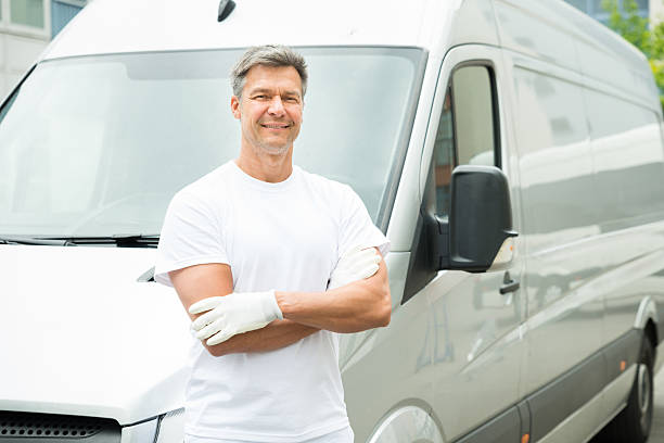 istock Painter With Arms Crossed In Front Of Van 518498072