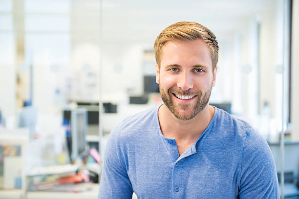 istock Casual young man in office 518498233