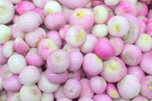 istock red onion in market 518498287