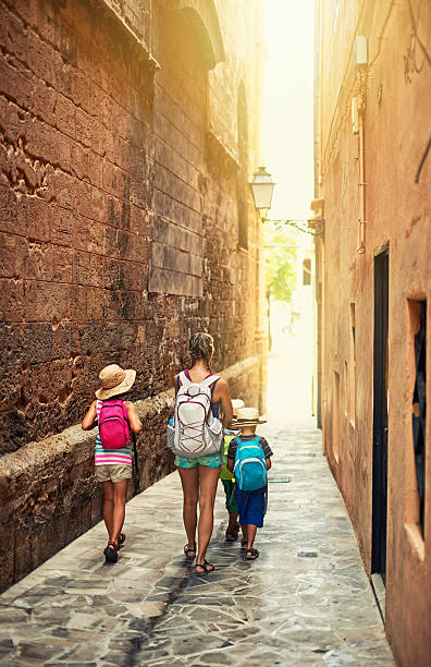 istock Family visiting mediterranean town. 518498627